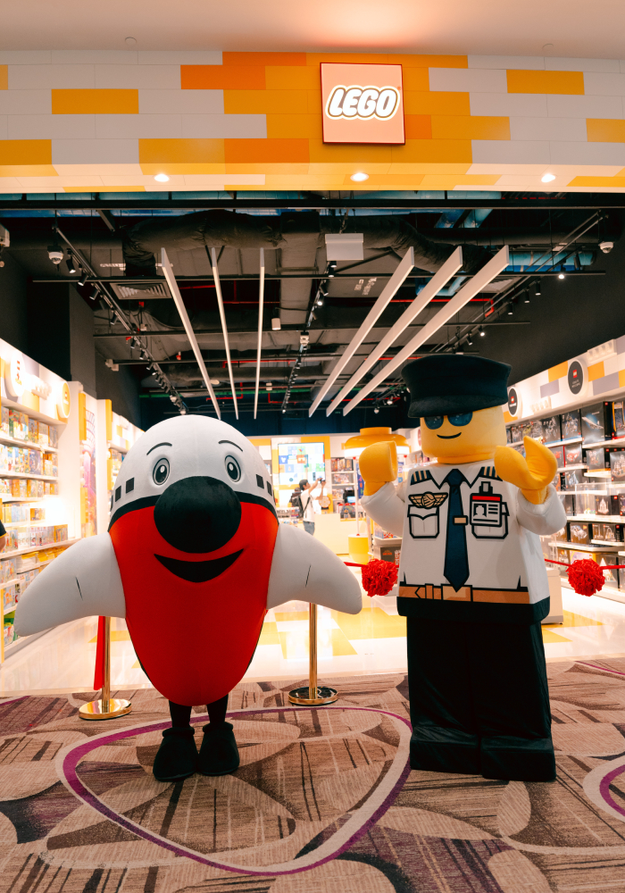 max the plane and lego pilot mascot