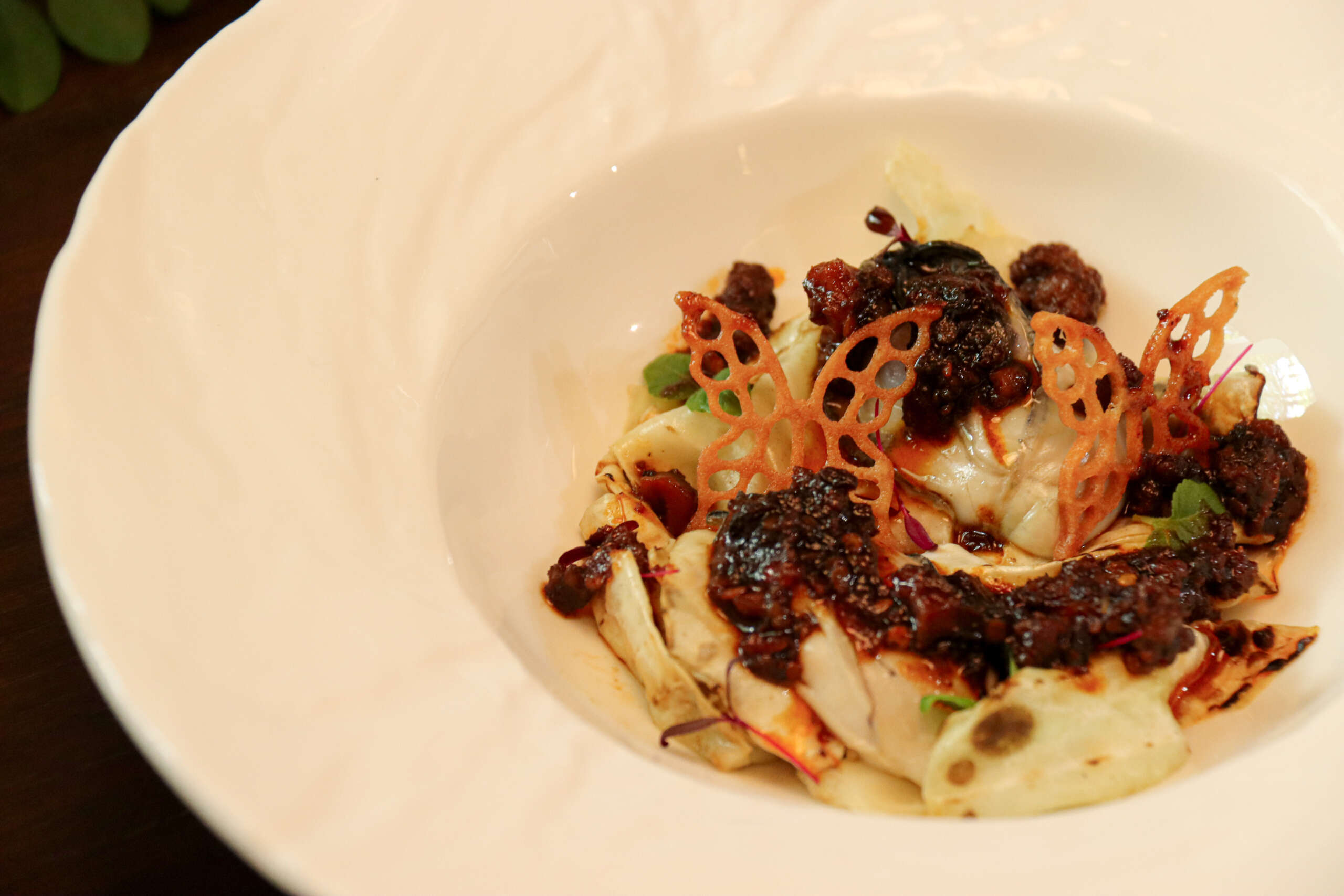 Poached Japanese oysters with ox heart cabbage and chilli beef