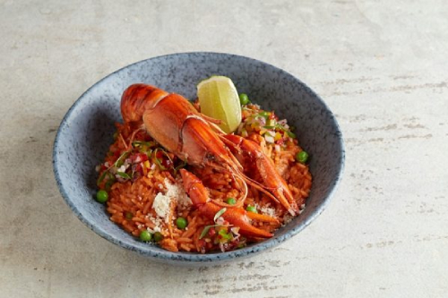 Photo of crayfish on a bed of rice from Canchita