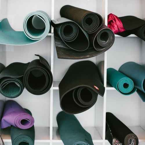 rolls of yoga mats photo source jordan nix unsplash